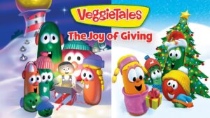 VeggieTales: The Joy of Giving poster with a group of anthropomorphic vegetables in a snowy holiday scene, gathered around gifts.