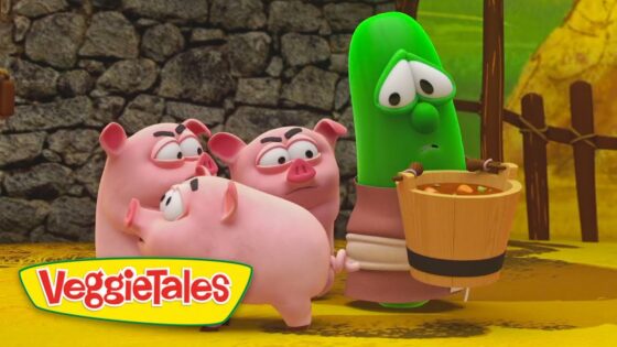Green cucumber character looks worried while three pigs gather around a wooden bucket of food.