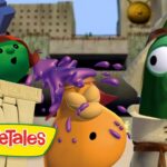 VeggieTales characters in an ancient temple as purple slime splashes onto an orange veggie, with two surprised lookers nearby.