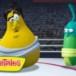 Two VeggieTales characters—yellow banana in a white robe and a green worm—stand in a boxing ring, VeggieTales logo visible in the corner.