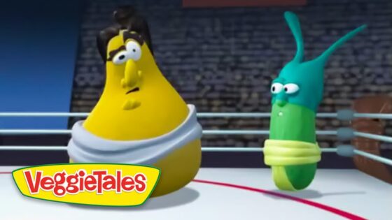 Two VeggieTales characters—yellow banana in a white robe and a green worm—stand in a boxing ring, VeggieTales logo visible in the corner.