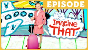 Young girl in a pink suit with a pink rolling suitcase poses in front of a bright, doodle-style background that reads 'Imagine That!' in red letters.