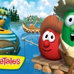 Three VeggieTales characters—a yellow veggie, a red tomato, and a green cucumber—stand on a wooden raft on a lake with a small guitarist boat in the background; trees and sky visible behind.