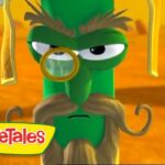 Green VeggieTales character with a monocle and long beige beard, standing in a yellow desert, VeggieTales logo in the corner.