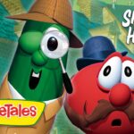 VeggieTales poster featuring a cucumber detective with a magnifying glass and a mustached red tomato, title 'Sheerluck Holmes and the Golden Ruler'
