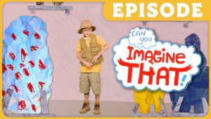 Young boy dressed as an explorer stands among colorful painted rocks and shapes with a comic-style 'Imagine That!' bubble and an episode banner above.