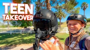 Thumbnail: two girls outdoors; one wears a black helmet with a full-face gas mask, the other smiles, with bold red 'TEEN TAKEOVER' text.
