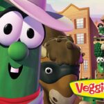 Three cheerful cartoon vegetables in a Western town with a colorful VeggieTales logo in the foreground.