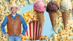 Smiling man in a cowboy hat and leather vest stands beside oversized ice cream cones and popcorn on a blue background.