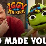 Bearded man in a red shirt and a green puppet holding a wooden bat, both looking thoughtful; bold 'GOD MADE YOU' text overlays the thumbnail.