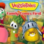 VeggieTales characters stand together with the 'Family Comes First' slogan in a bright, cartoon countryside background.
